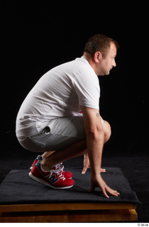  Louis  2 dressed grey shorts kneeling red sneakers sports white t shirt whole body 0007.jpg